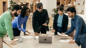 A sleek, modern office interior with a large Google Play logo prominently displayed on the wall. The room is filled with natural light, streaming in through floor-to-ceiling windows. A group of developers are gathered around a table, intently discussing their app's listing and optimization strategies. The atmosphere is one of focus and collaboration, with a sense of excitement and anticipation about the upcoming publication process. The lighting is warm and inviting, creating a professional yet approachable ambiance. The camera angle is slightly elevated, capturing the scene from an overhead perspective to convey a sense of organization and cohesiveness.