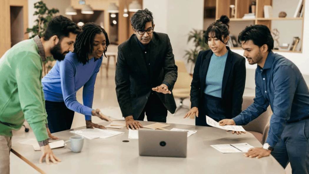 A sleek, modern office interior with a large Google Play logo prominently displayed on the wall. The room is filled with natural light, streaming in through floor-to-ceiling windows. A group of developers are gathered around a table, intently discussing their app's listing and optimization strategies. The atmosphere is one of focus and collaboration, with a sense of excitement and anticipation about the upcoming publication process. The lighting is warm and inviting, creating a professional yet approachable ambiance. The camera angle is slightly elevated, capturing the scene from an overhead perspective to convey a sense of organization and cohesiveness.