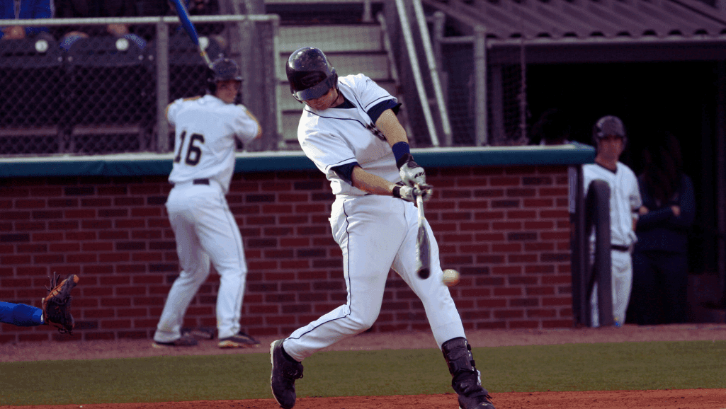 A grand baseball stadium bathed in the warm glow of a golden hour sunset, its pristine diamond field a canvas for the rarest and most revered achievements in the sport. In the foreground, a pitcher stands triumphant, his arm raised in celebration of a perfect game, the crowd erupts in thunderous applause, their faces alight with wonder and awe, as this historic moment is etched into the annals of Major League Baseball history. In the background, the towering scoreboard displays the flawless box score, a testament to the athlete's mastery and the game's timeless allure. This image captures the essence of perfection, where the impossible becomes reality and legends are born.